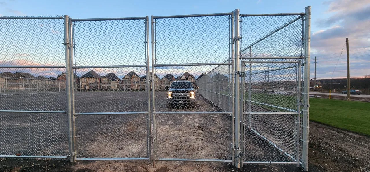 Galvanized chain link double drive gate at a commercial yard